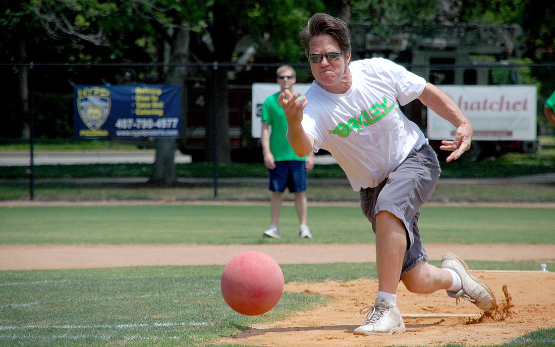 Photo by: Isaac Babcock - Former Maitland Mayor Doug Kinson pitches at the Friends of First Response-Maitland's Kickball Tournament on May 1.