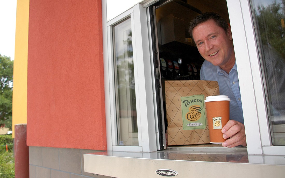 Photo by: Isaac Babcock - Panera Bread Director of Operations Ken Devine shows off the drive-through window at the new Aloma Avenue restaurant, which opens on Wednesday, July 6.