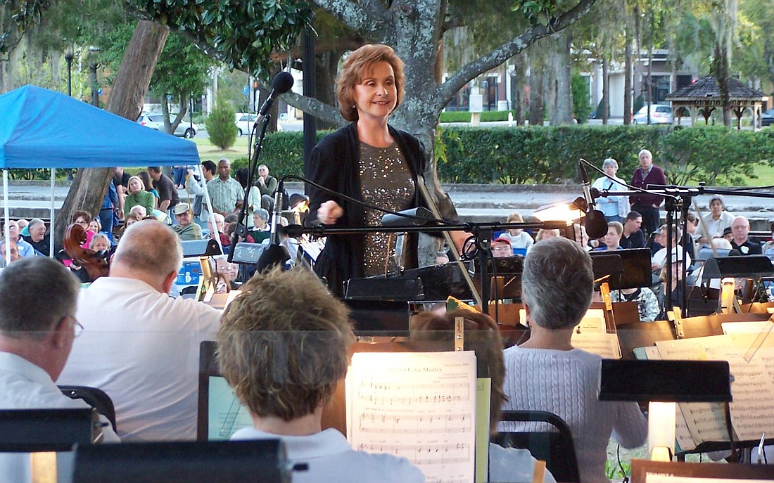 Photo courtesy of Orlando Philharmonic Orchestra - Candy Crawford conducts the Orlando Philharmonic Orchestra, which held its annual outdoor Spring Pops concert on Sunday, March 13, at 7 p.m. in Central Park. Winter Park resident Kenneth Murrah was ho...