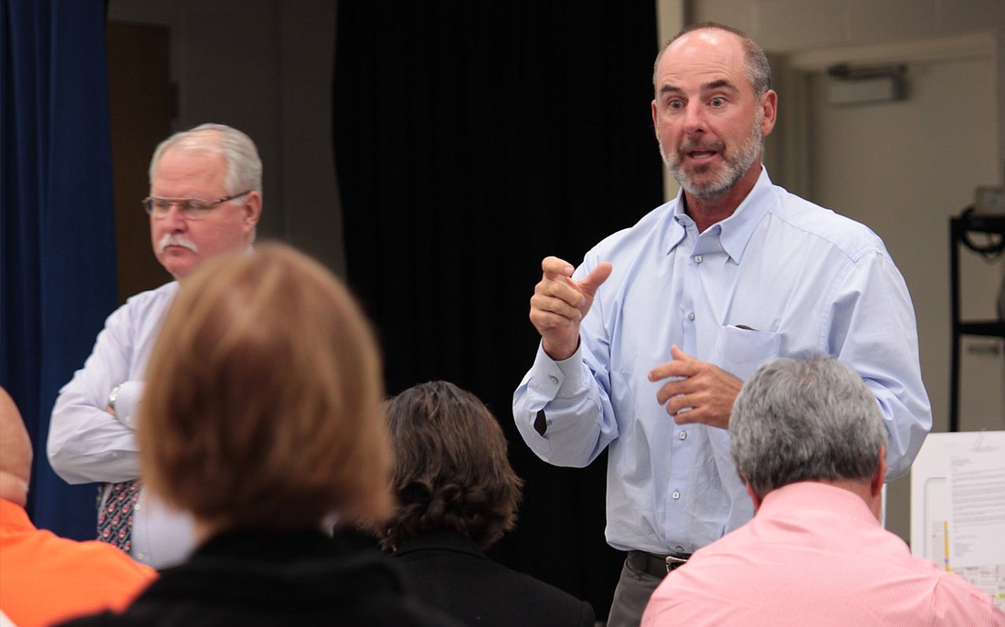 Photo by: Amanda Georgi - Developer Dan Bellows responds to questions brought to his attention by concerned neighboring residents of the Ravaudage project in a community meeting Tuesday, April 12.