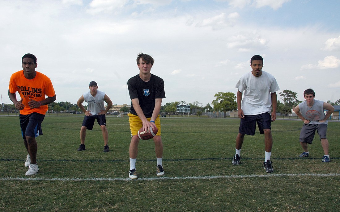 Photo by: Isaac Babcock - Rollins College Football Club President Jeff Hoblick, center, and some pioneering players hope to revive a team that hasn't played organized football since 1949.