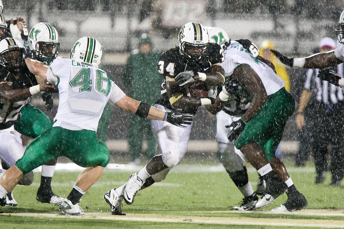 Photo by: UCF athletics - Running back Brynn Harvey ran for nearly 200 yards on a rain-soaked field against Marshall Oct. 8, carrying the ball 30 times.