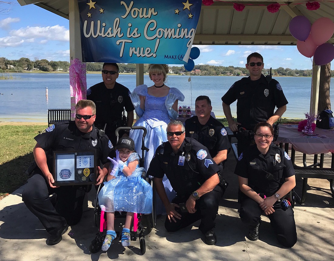 Officers from the Ocoee Police Department helped celebrate Katieâ€™s wish to go to Disney World.