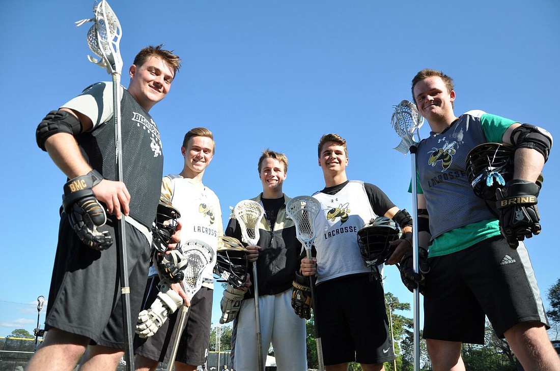 (From left to right) Charlie Rask, Christian DiPaolo, Robbie Bennett, Parker Blystone and Will Jones serve as team captains of the Bishop Moore varsity lacrosse team.