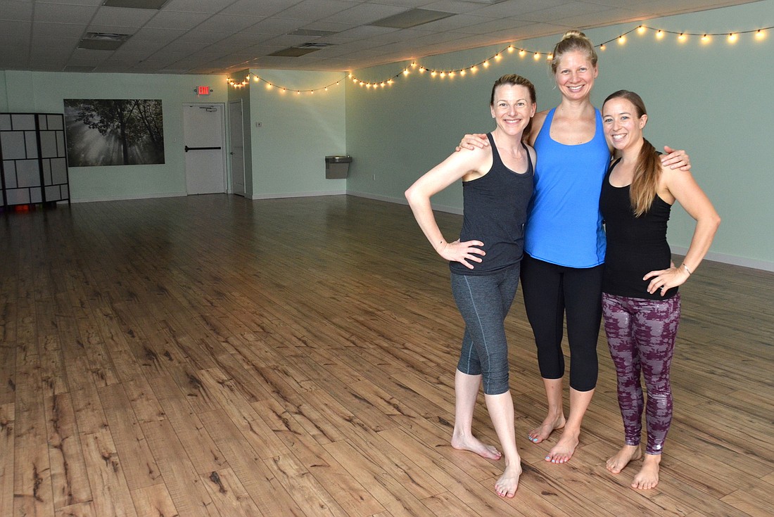 Melanie Sachs, left, Holly Garrison and Sarah Rosenburg are excited about growing the community at Firefly Yoga in Ocoee.