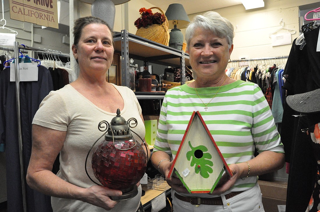 Susan Laws and Roberta Levinson are two of the volunteers who run the Winter Park Benefit Shop.