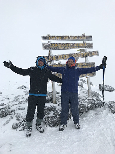 Anthony Lightman, left, and Matt Durfee managed to reach the Uhuru Peak - the summit of Mount Kilimanjaro - after five straight days of hiking.