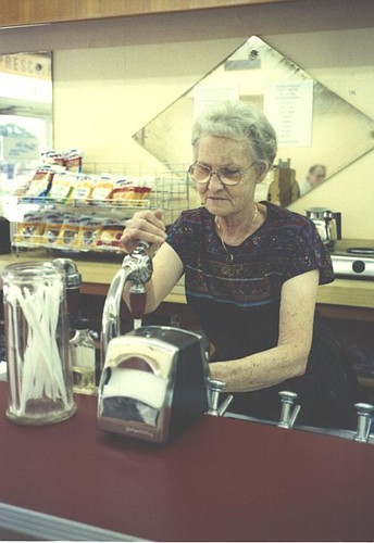 In July 1991, Ara Norris Taylor works the Davis Pharmacy soda fountain on Plant Street in Winter Garden; Ara began her duties at the shop in 1954. That year, the fountain made its reappearance after almost two decades.