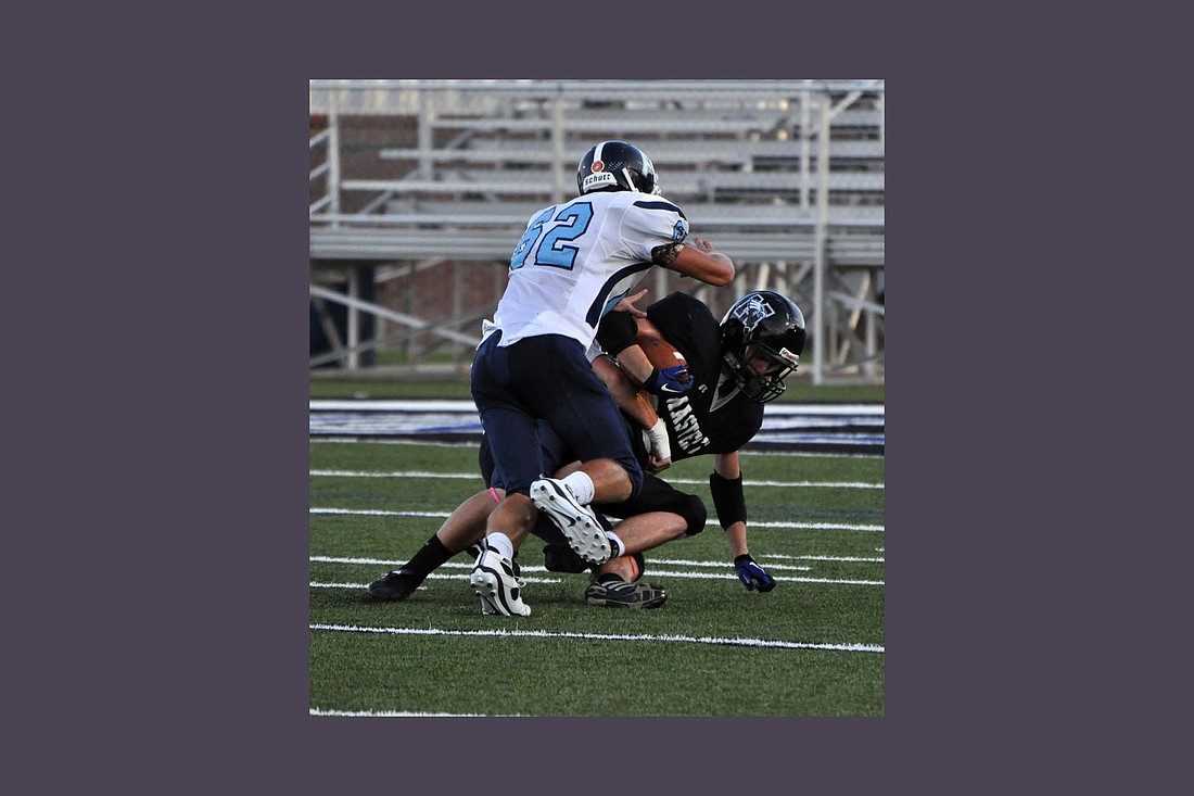 Riley Thomas makes a tackle against The Master&#39;s Academy during his varsity career with Foundation Academy. Courtesy photo