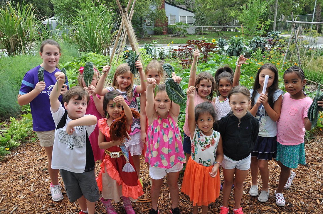 A group of 15 children and their parents from the Baldwin Park Kids Club visited the Emeril Lagasse Foundation Kitchen House & Culinary Garden in early June.