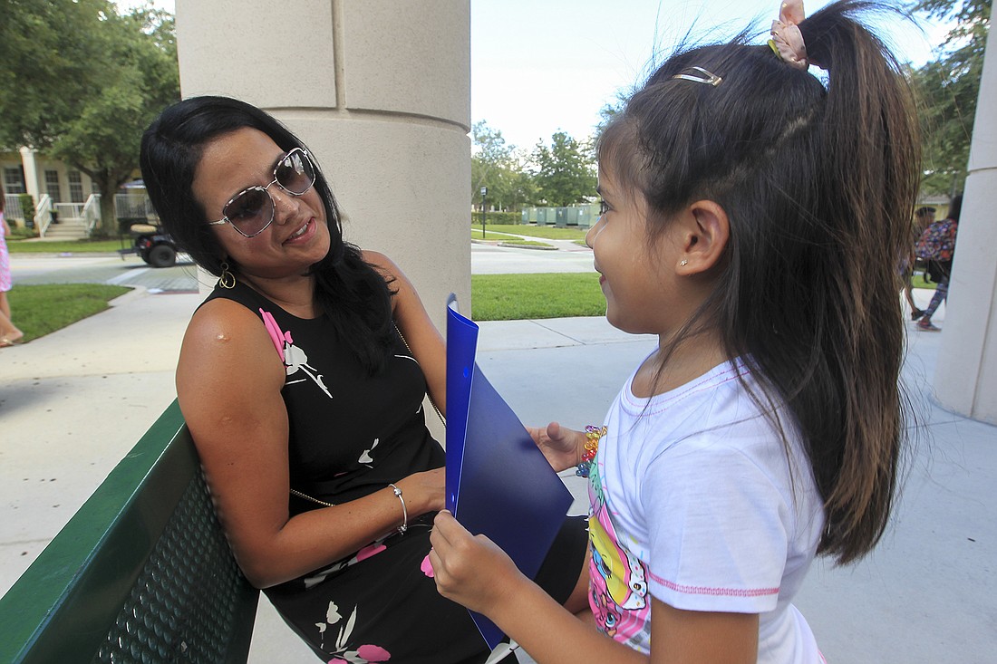 Camilla Cardenas, 5, tells her mom, Sylvia, about her day in school.