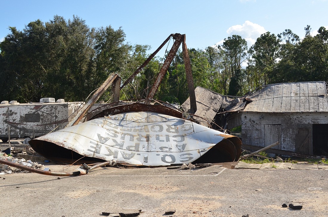 Lester Austin suspects a tornado struck the SLACGA water tank based on the twisted metal.