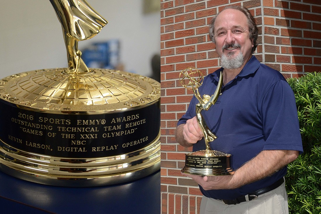 Kevin Larson is all smiles with his Emmy award at the South Campus of Foundation Academy, where he had presented the trophy during a show-and-tell session. Larsonâ€™s two sons, Ben and Sam, attend the Winter Garden-based school.