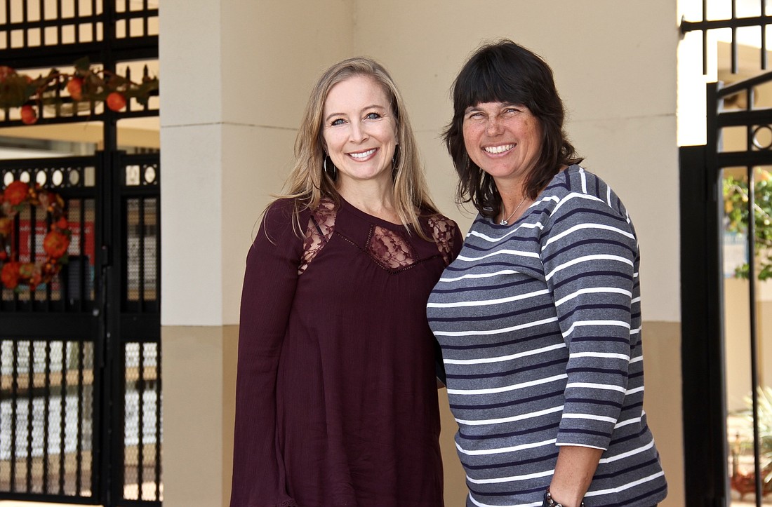 Suzanne Maphis, left, and Sharon Oâ€™Malley have worked together for the last seven years to organize Holy Family Catholic Schoolâ€™s Raise the Dough fundraiser and raised a grand total of $1.4 million.