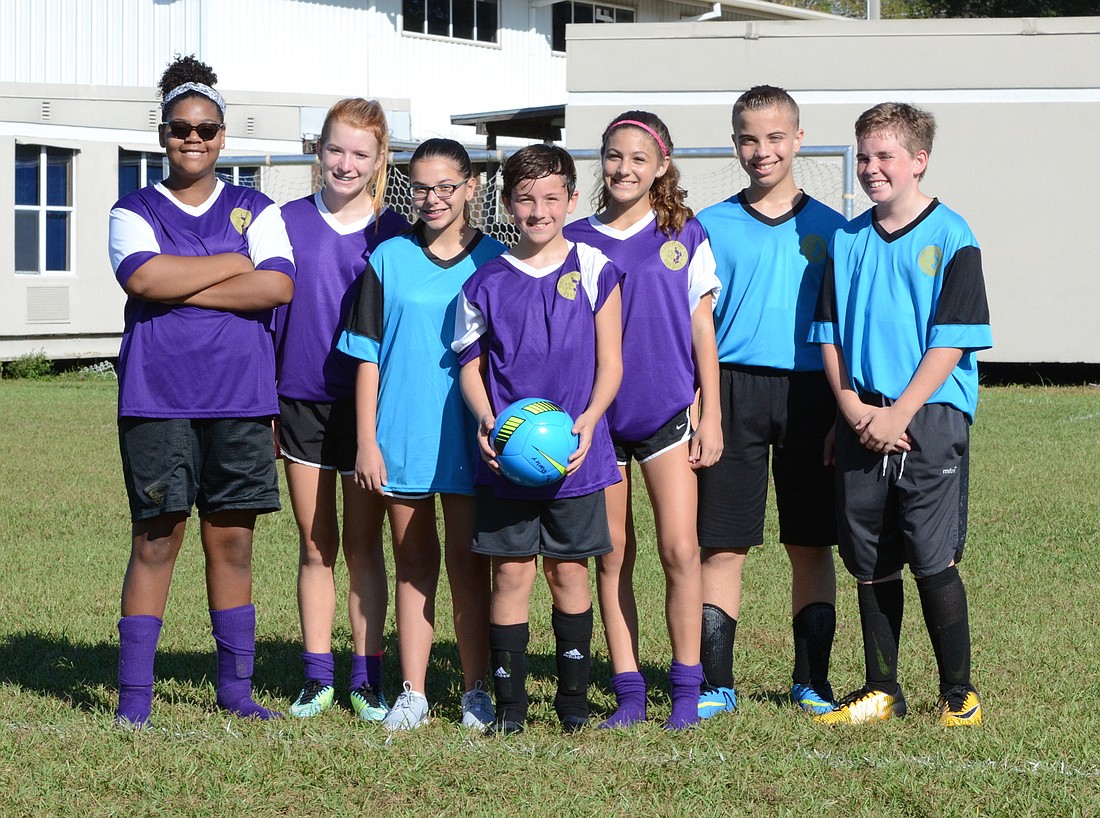 Isa Lares, left, Madison Murdock Vaughn, Melanie Gitto, Johnathan Lares, Paityn Bristine, Joey Dooley and Connor McDaniel all love playing soccer for the Firestorm FC  Soccer League in Winter Garden.