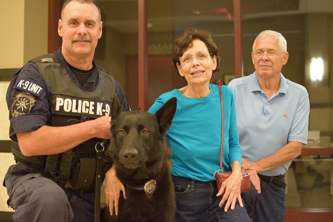 K-9 officer Kimber is given to Orlando residents Charles and Marcia Doyle â€“ Winter Garden Police Officer Jeff Doyleâ€™s parents â€“ on the day of his retirement.