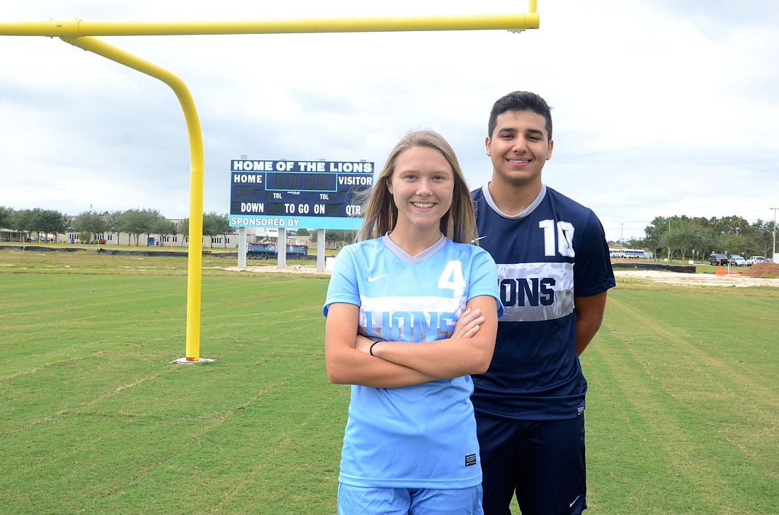 Foundation Academy soccer players Scarlett Cooper and Daniel Garcia are excited about the possibility of playing the first game on the schoolâ€™s new field.