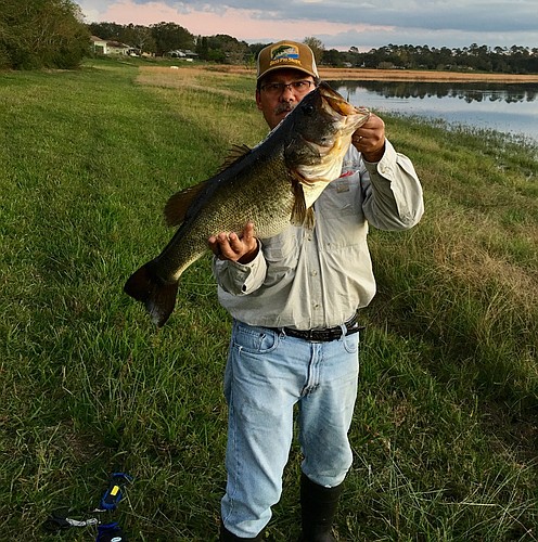Ocoee resident â€œCaptainâ€ Mike Iglesias is proud of his trophy catch, a largemouth bass that weighed nearly 11 pounds â€” his personal best.