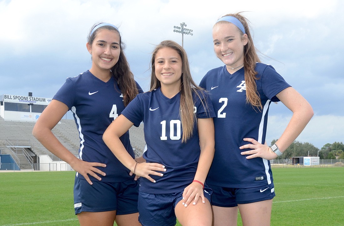 Steven Ryzewski Senior captains Stephanie Oliveira, left, Carmel de Oliveira and Madison Lamb are excited about making a run at a district title and beyond as the season winds to a close.