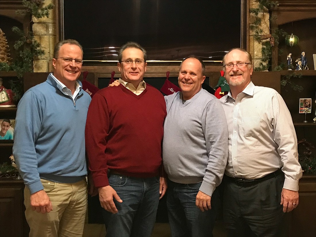 Rod Talbot, right, met his three half-brothers for the first time over the holidays: Doug, left, Daniel and David Gaumer.