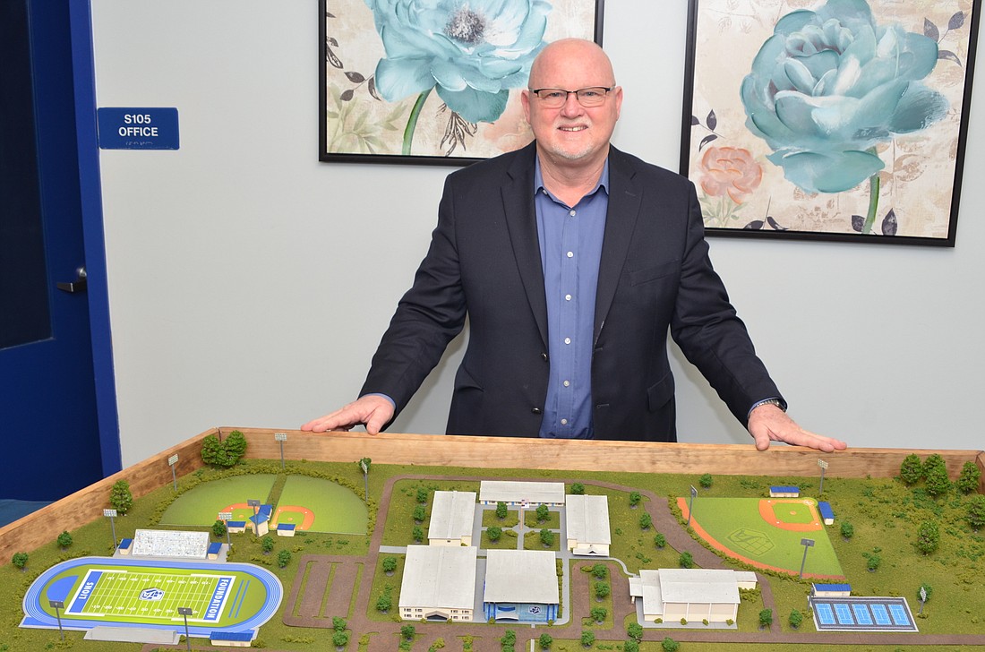 Dave Buckles, president of Foundation Academy, displays a 3D vision for the school campus.