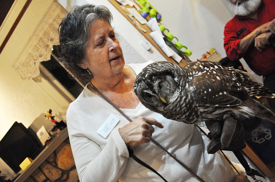 Volunteer Claire Robinson introduced Merlin, a 31-year-old barred owl, to visitors at the recent Owl Prowl event.