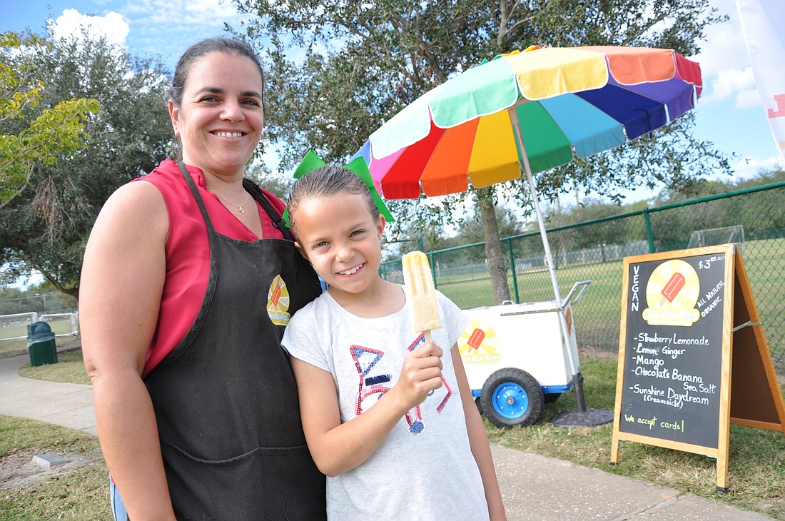 Caroline DeSormoux and her daughter, Luna, are selling healthy treats.