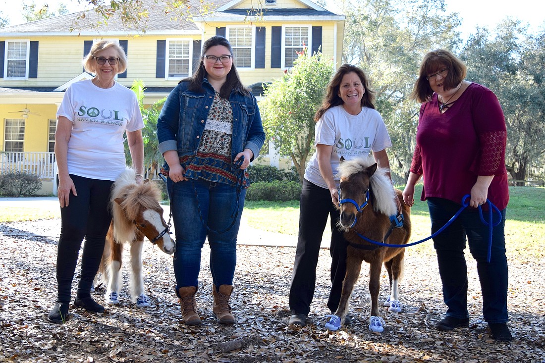 Soul Haven Ranch volunteer Gloria Green, mini horse Shelton, Jordan Green, Soul Haven Ranch owner Susan Nastasi, mini horse Ellie and Teddy Mountain Chief Production Officer Jenni Green were all smiles.