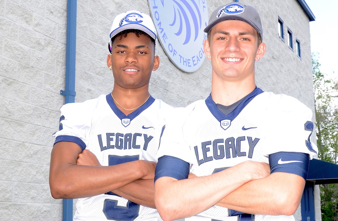 Donning hats for Chowan University, where they will play college football, Jalen Swift, left, and Dylan Clinger are proud to be Legacyâ€™s first Division II recruits.