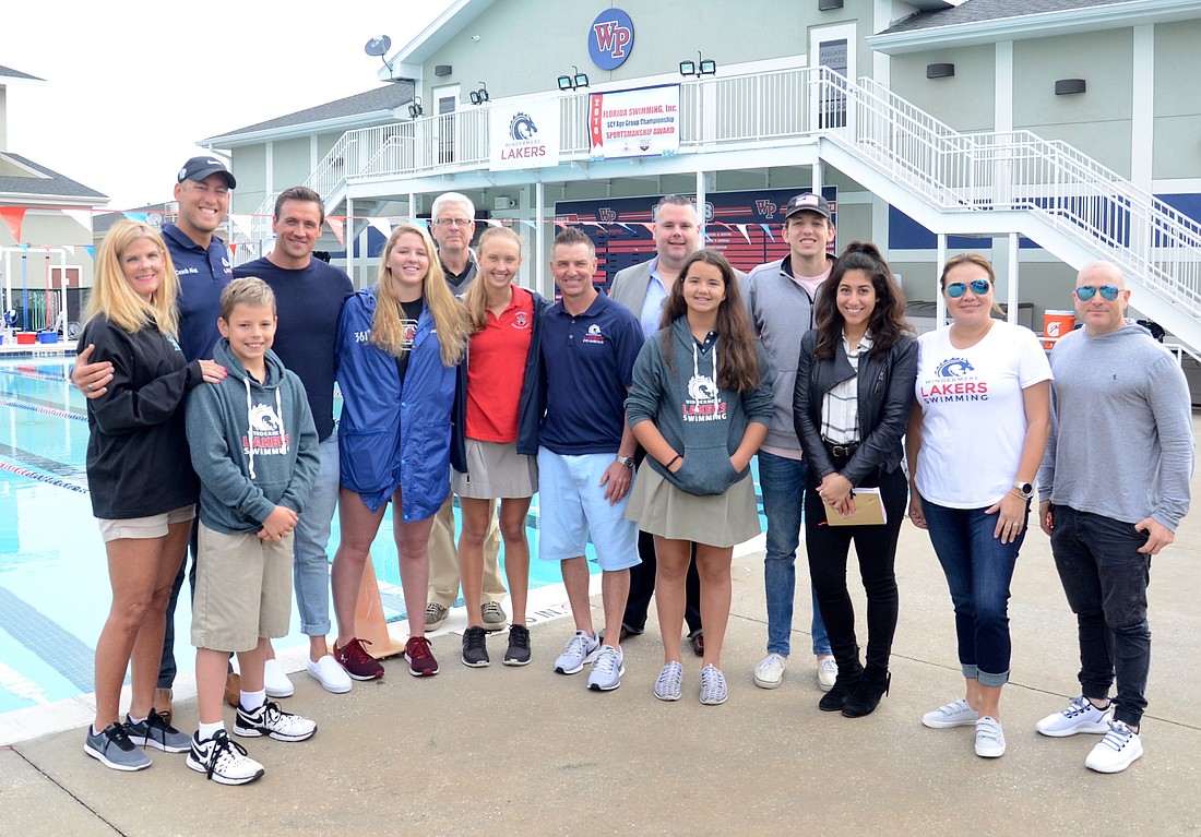Ryan Lochte, fourth from left, stopped by Windermere Prep March 12 to talk about the swim clinic that will be hosted at the campus April 14.