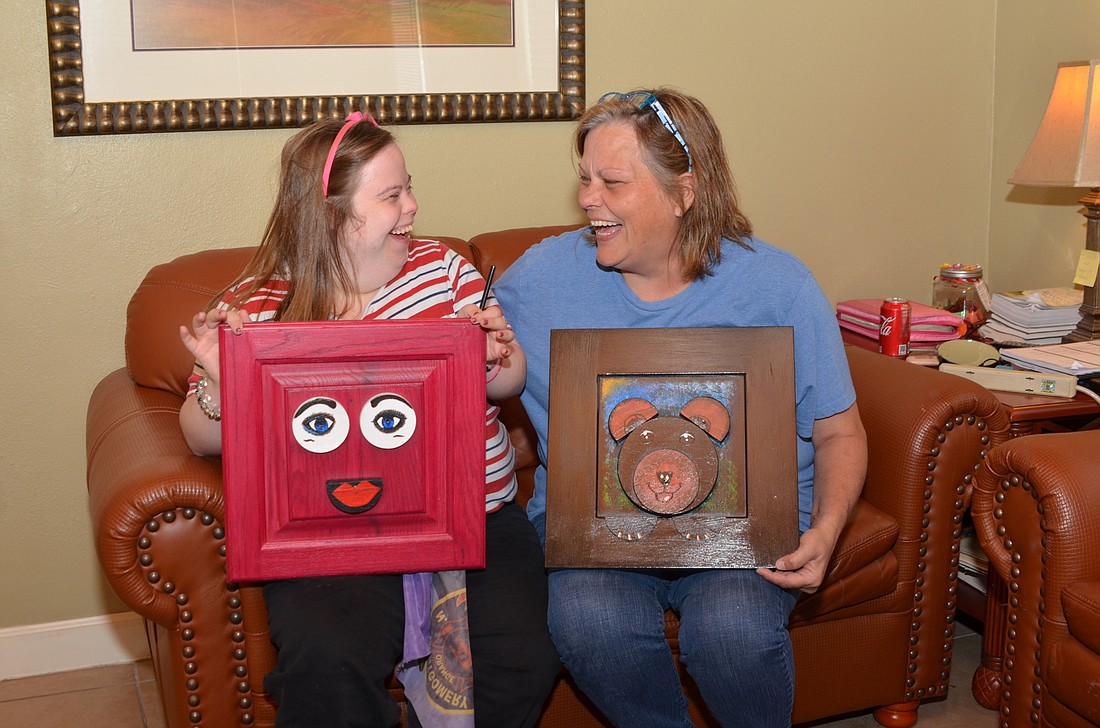 Sherry Easley and her daughter, Alivia, create and sell original pieces of art made of scrap wood.