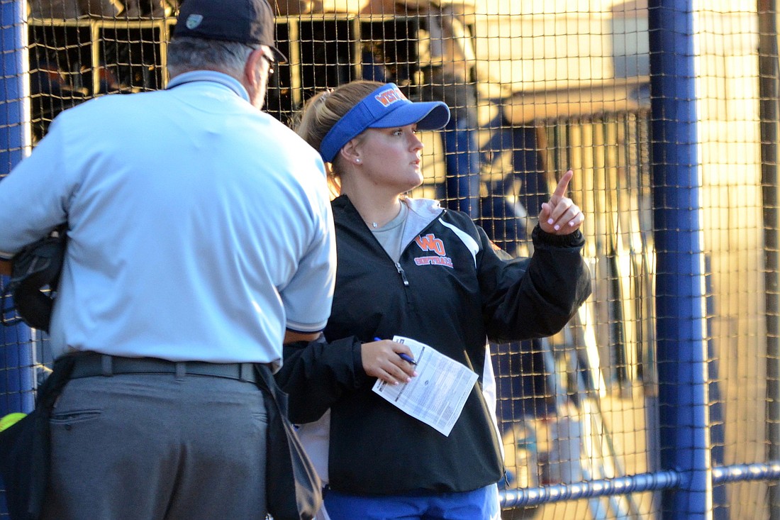 Steven Ryzewski West Orange softball interim coach Kelsey LaNeave chats with the home-plate umpire between innings of the Warriors 11-1 win against the East River Falcons April 11.