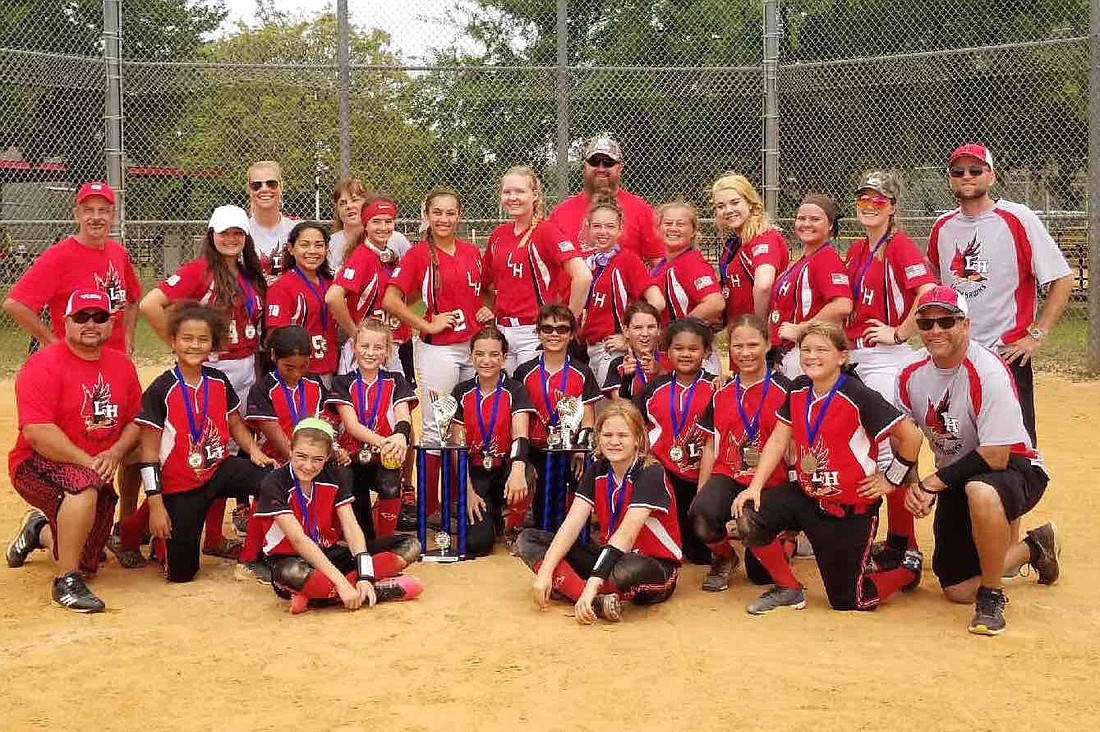 The Lady Hawks high-school and 10U teams were all smiles after winning their respective tournaments April 22 at the NSA Spring Travel Ball League Double Elimination Tournament. Courtesy photo.