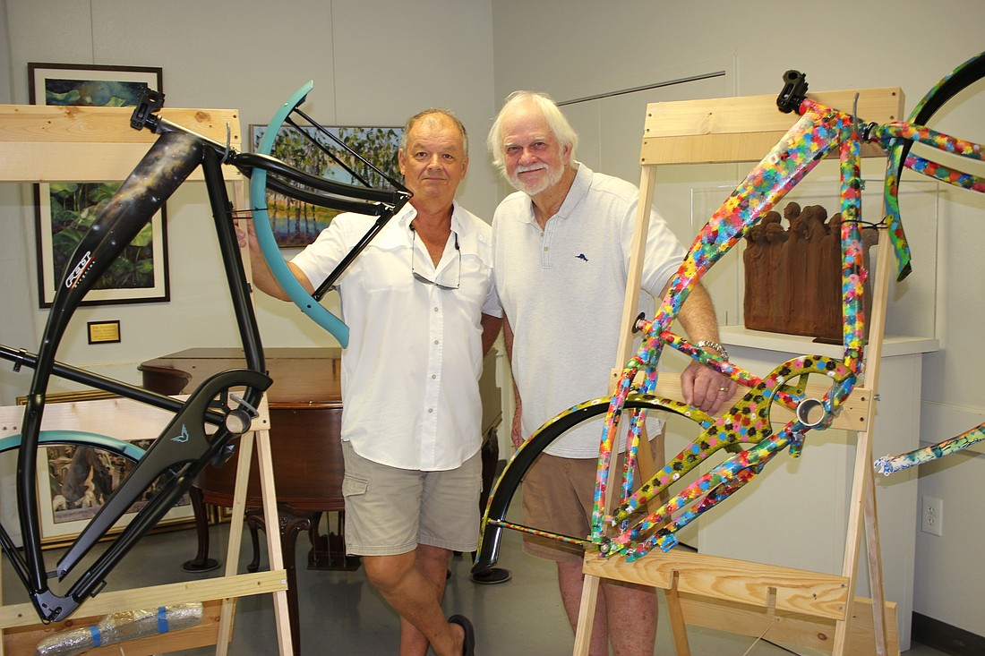 Mike Malloy, left, and Paul Gerding show off their SOBOcycles.