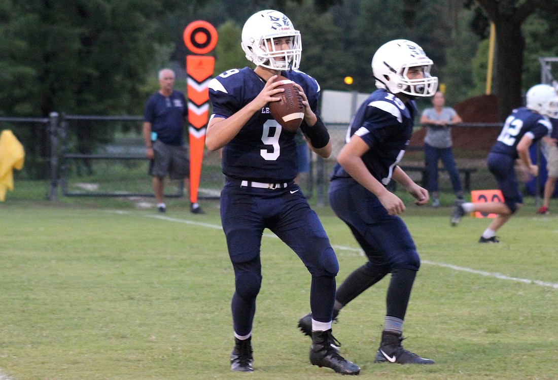 Quarterback Jacob Worley threw two touchdowns and ran for another in Legacy&#39;s win. Photo by Nate Marrero.