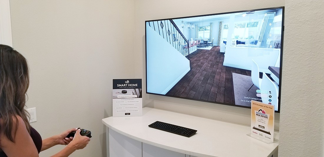 Pulte Homes&#39; virtual-reality tour uses a television and a game controller. (Courtesy Matthew True)