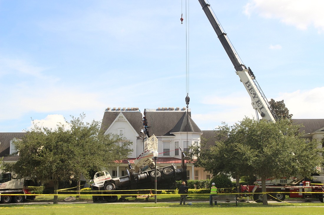 A crane tore open a Baldwin Park home on Lower Park Road.