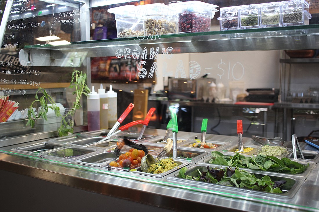 Pressâ€™d Juice Bar & Kitchenâ€™s build-your-own salad bar offers a wide variety of greens, grains and other toppings to please any palate.