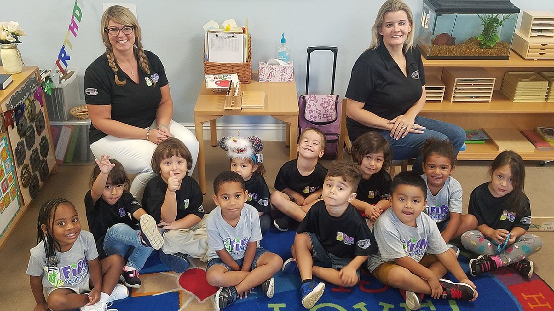 Meagan Galamback and her co-teacher, Shannon Knorr, are surrounded by eager learners in the preschool program.