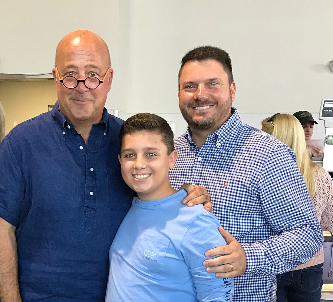 Andrew Zimmern, Max Lombardi and Mike Lombardi posed for a photo together during the day of filming.