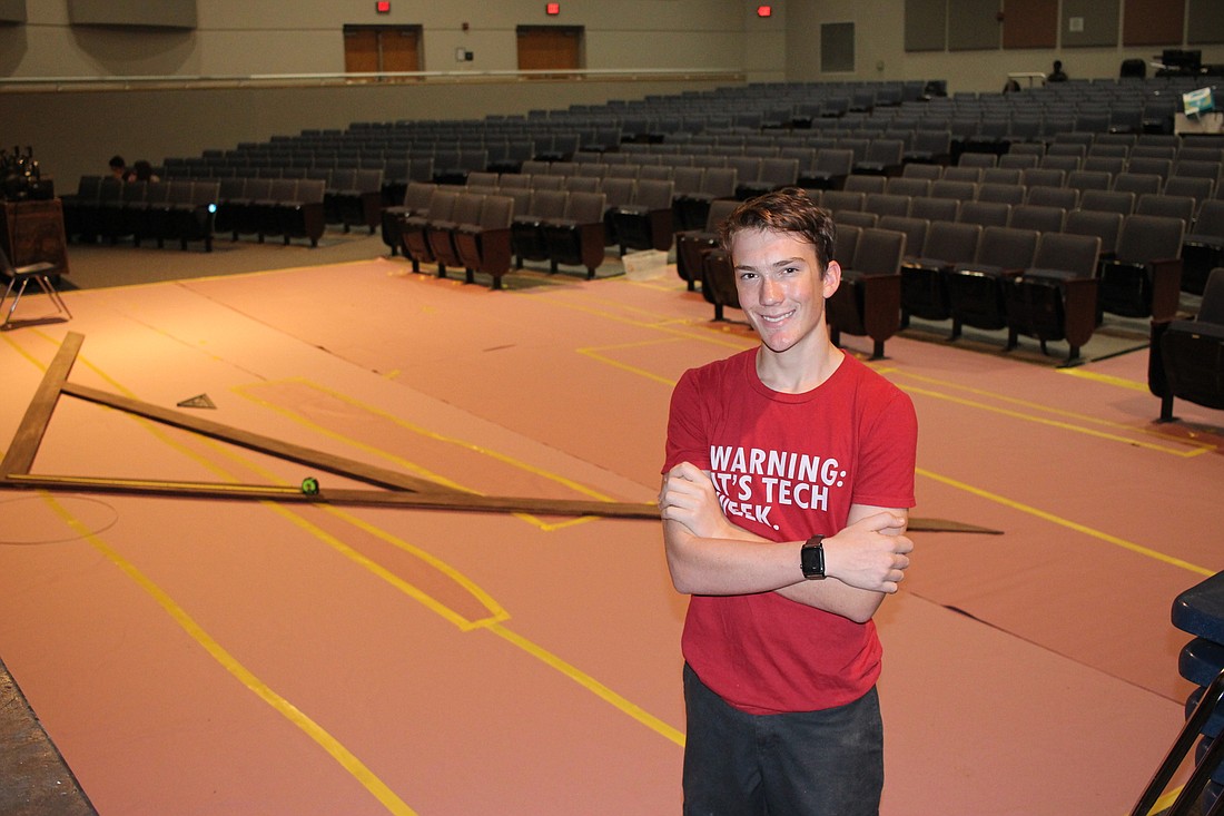 Junior Carlton Morrissey is the sound and lighting director forâ€Little Women.â€ A pink paper tarp covers parts of the theaterâ€™s carpeting, which was removed after a bathroom leak flooded part of the theater.