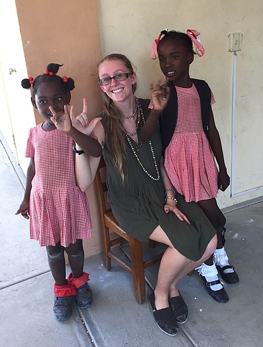 While in Haiti, Christy Daugherty taught children how to say â€œI love youâ€ in American Sign Language.