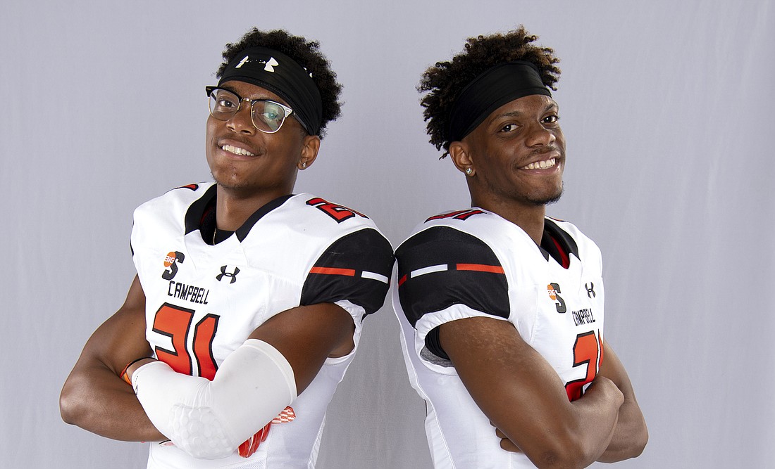 Photo by Bennett Scarborough / Courtesy of Campbell University Athletics â€” Now in college, Lance Axson, left, and Lester Axson have been playing together since youth football.