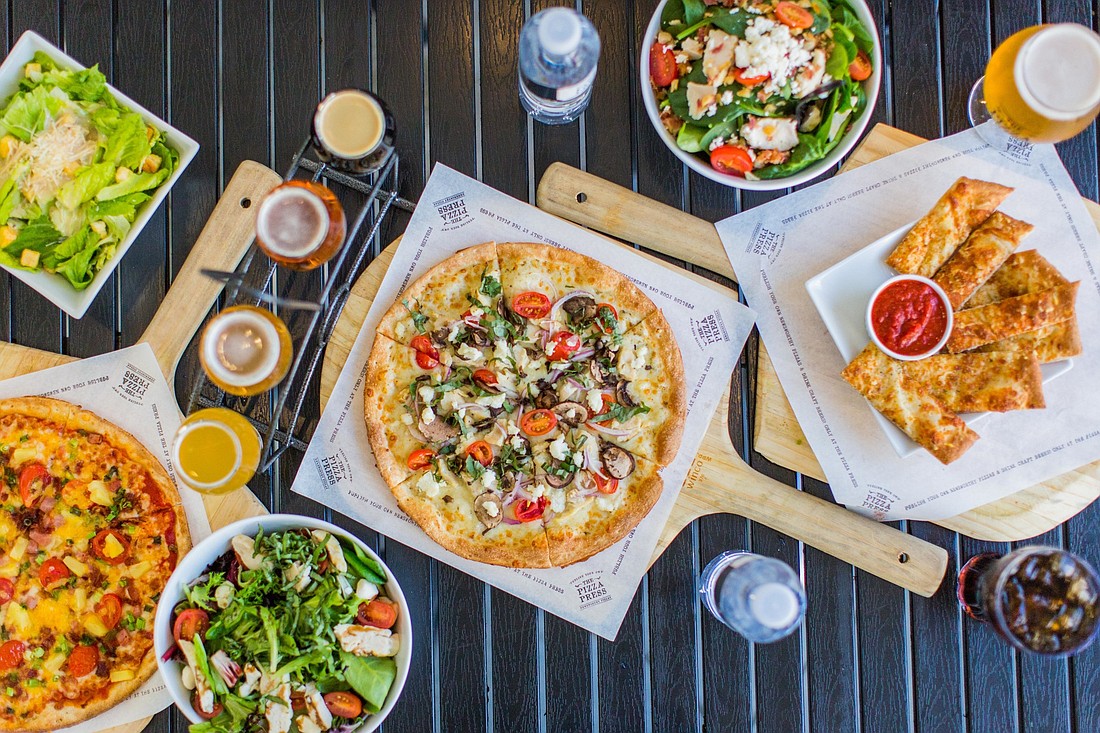The Pizza Press serves up personalized pizzas with a wide selection of craft beers.