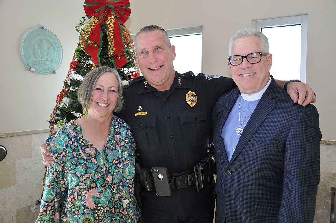 Sharon and Reggie Kidd (left and right) have formed a close bond with Maitland Police Chief David Manuel.