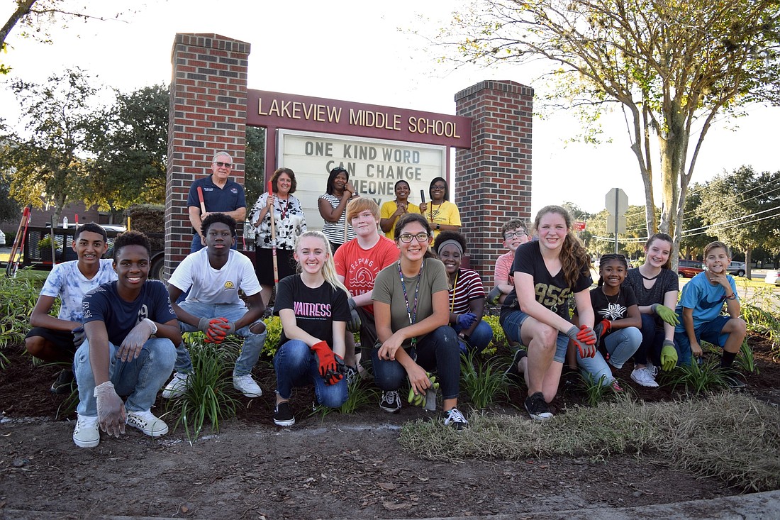 Lakeview Middle School staff, students and volunteers helped update the landscaping in front of the schoolâ€™s entrance.