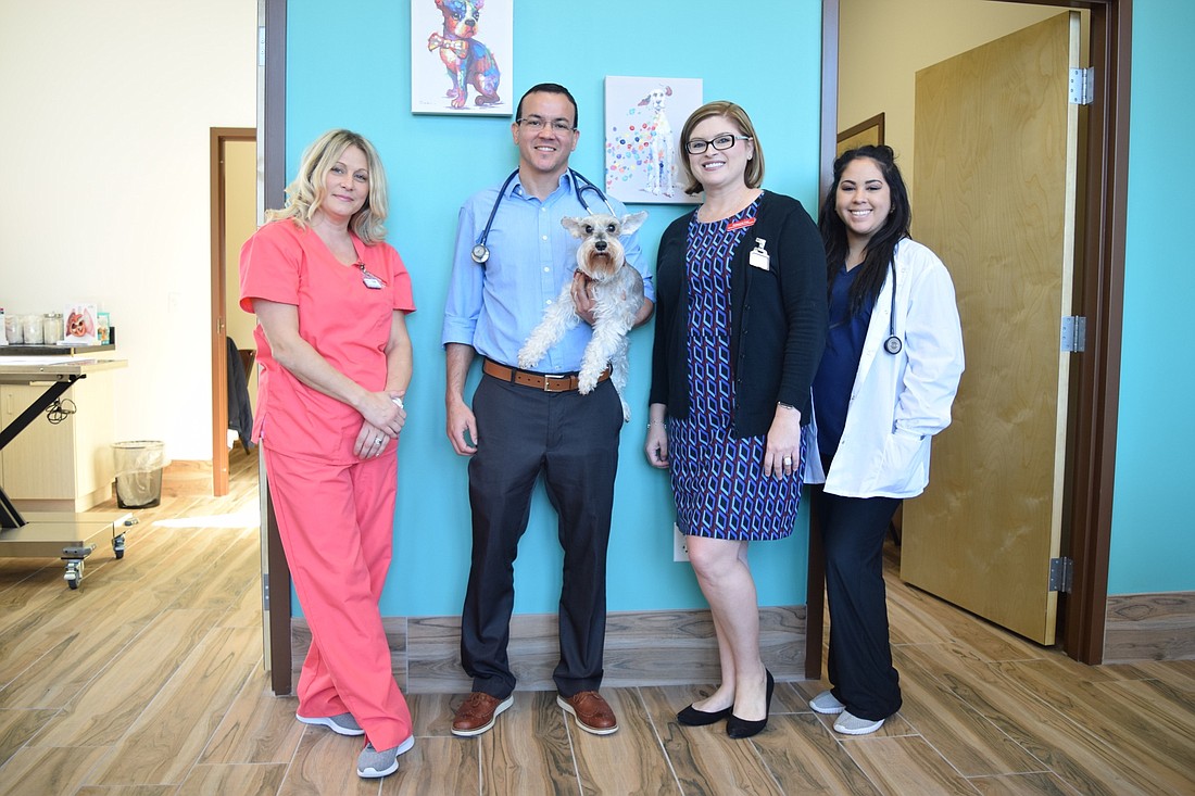 The staff at Wintermere Pointe Animal Hospital are excited to care for their new clients. From left: Carla Hodge, Dr. Pedro Santiago, Rebecca Fox and Joselyn Pinto.