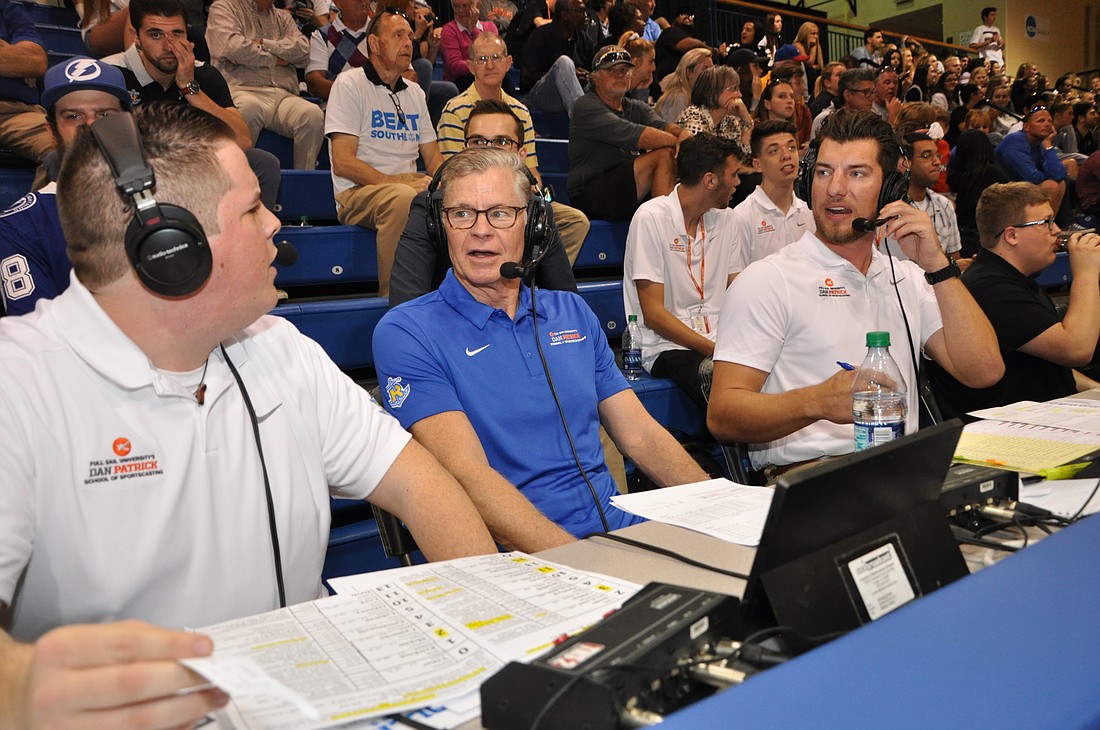 Legendary sportscaster Dan Patrick, center, gave some of his sportscasting students guidance during a recent Rollins College basketball game.