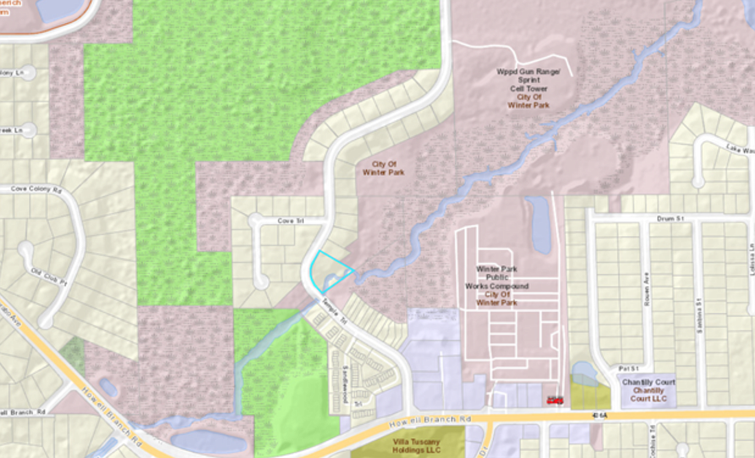 The piece of property purchased by the city, highlighted in blue, will be turned into a passive park space.