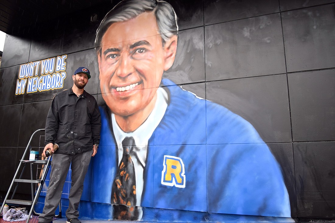 Jonas Never recently painted a mural of Mr. Fred Rogers on the wall of the Floydâ€™s 99 Barbershop in Winter Park.
